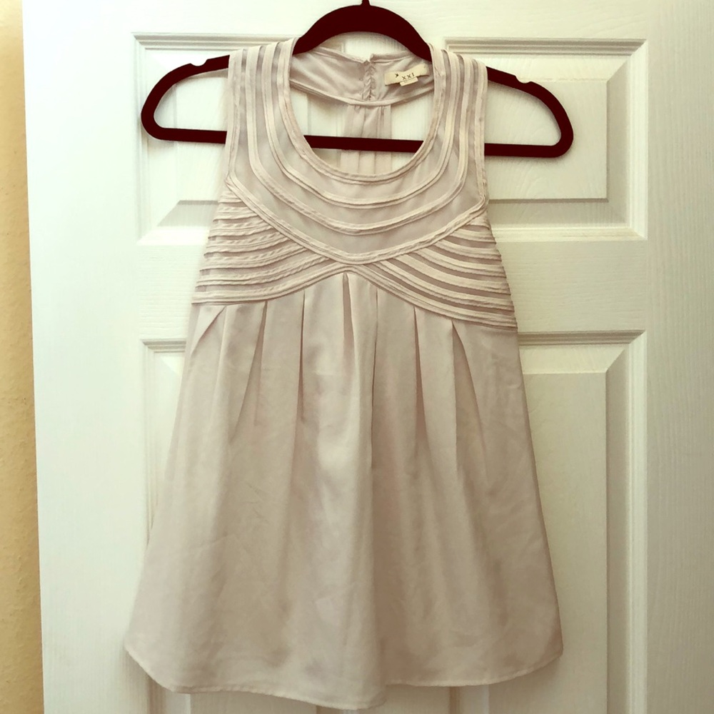 Beige baby doll top.